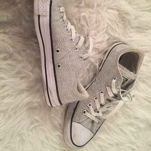 Grey and white converse.